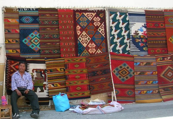 Vendor selling rugs, Mexico