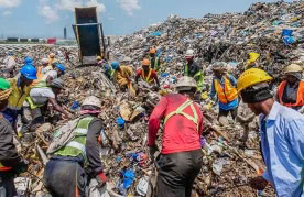 Waste pickers collecting recyclables on Kpone Landfill in Accra, Ghana