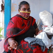 A garment worker stitches in Tiruppur, India, during the Covid-19 pandemic