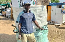 Waste Picker of Mushroomville with his collected materials