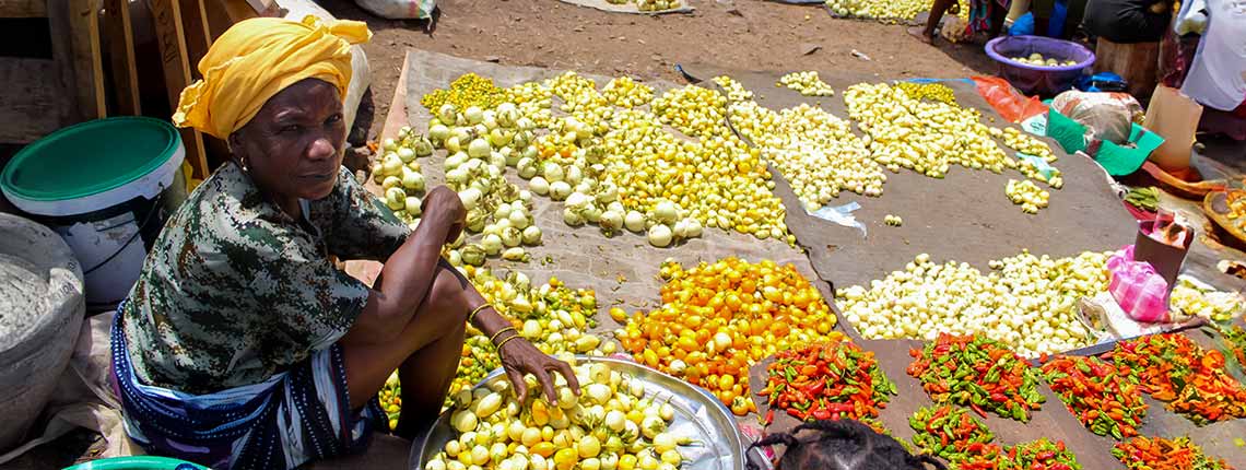 A street vendor sells her wares in Monrovia, Liberia