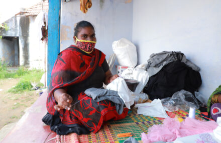 A garment worker stitches in Tiruppur, India, during the Covid-19 pandemic