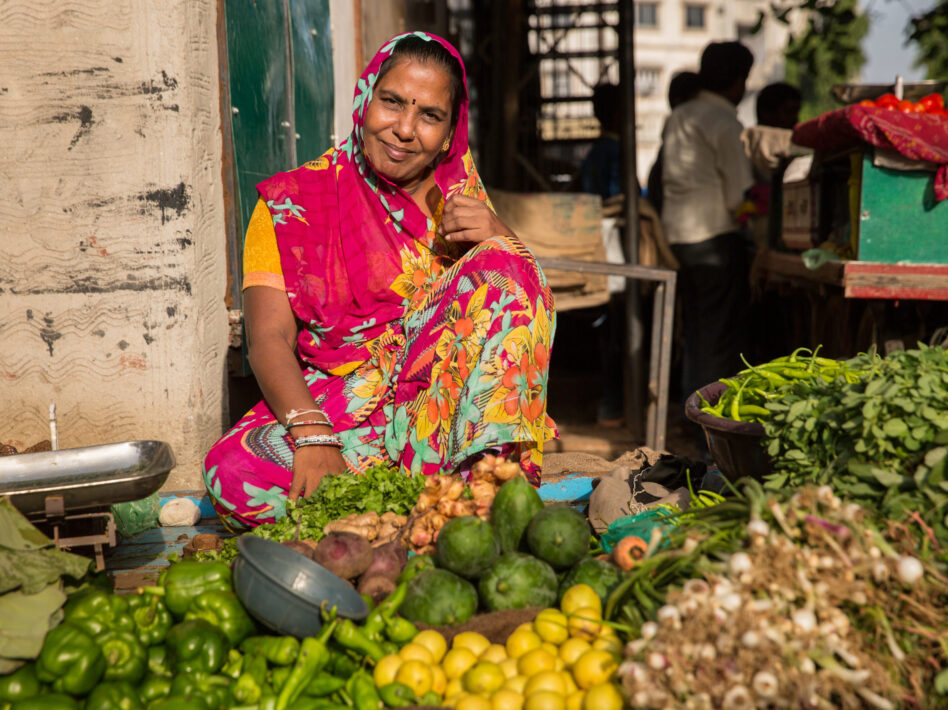 Choral Mauladia at her vegetable stall in a local market