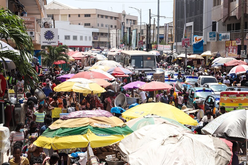 Street vendors and commuters interact in Accra's busy downtown.