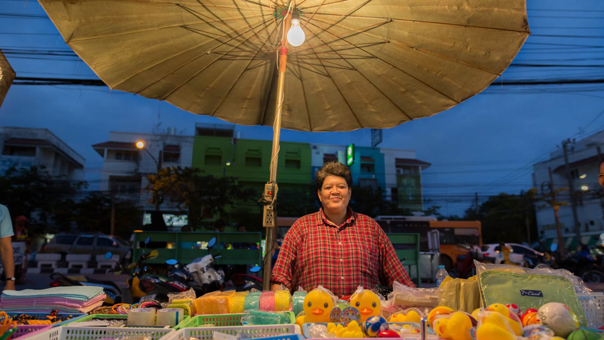 A market trader at her stall in Bangkok, Thailand. Credit: Paula Bronstein/ Getty Images